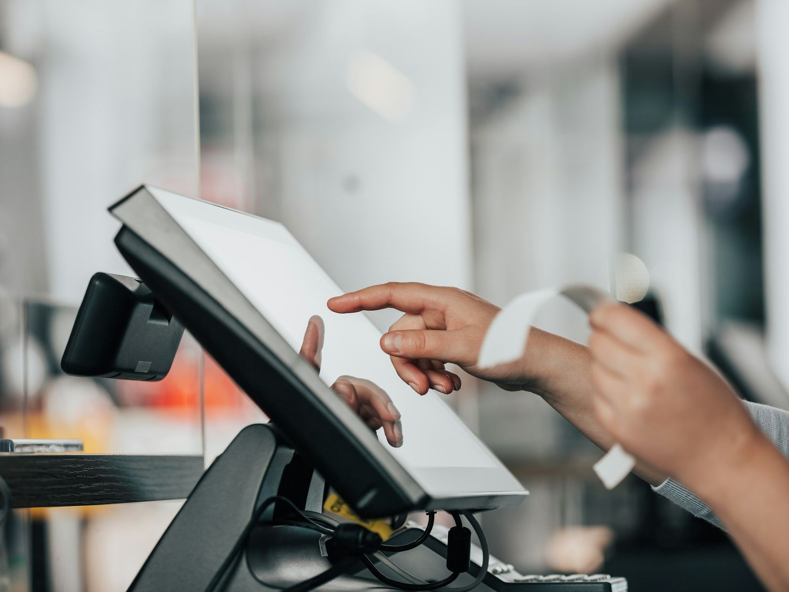 Touchscreen POS terminal at a checkout counter